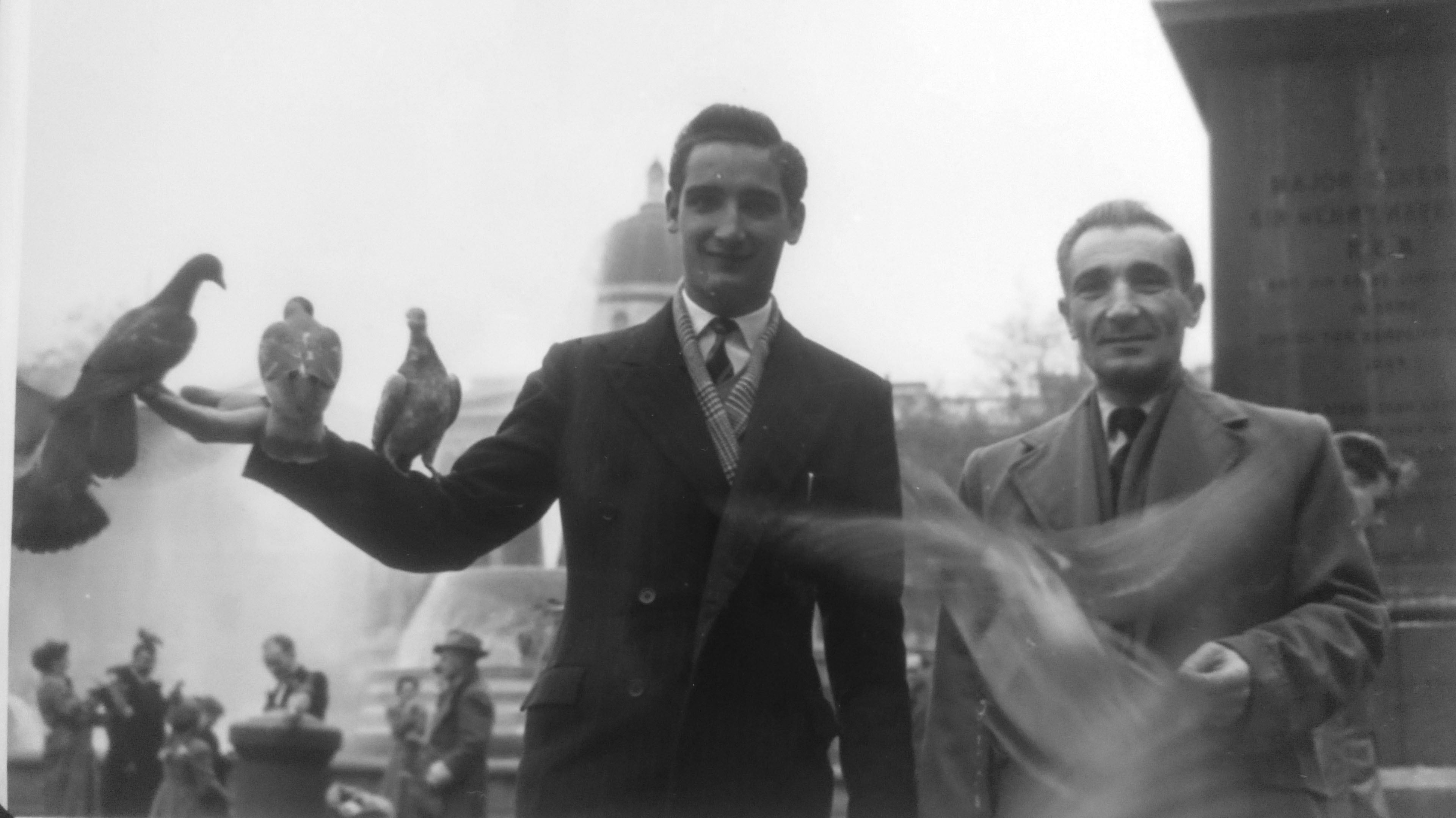 Michael is joined in London’s Trafalgar Square by his son Frank, freshly arrived to start a new life in Britain. Frank died in 2016, aged 80. Michael is joined in London’s Trafalgar Square by his son Frank, freshly arrived to start a new life in Britain. Frank died in 2016, aged 80.